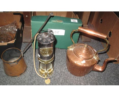 A box containing a copper and brass kettle, a copper cider ladle and a converted Thomas & Williams, Cambrian, Aberdare miner'