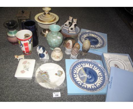 A box containing four onyx eggs, three marble egg cups and an onyx egg cup, two small Wedgwood Jasperware plates and a select