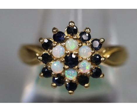 9ct gold opal and sapphire ring. Ring size N&1/2. Approx weight 3.6 grams. (B.P. 21% + VAT) Jewellery valuer not available so