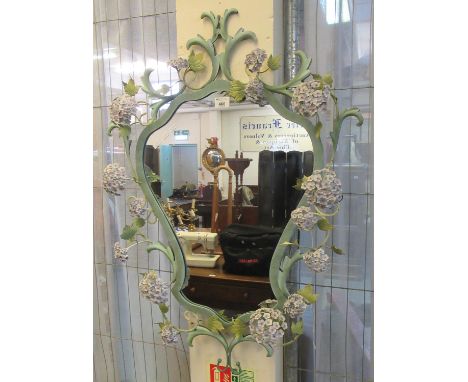 Unusual modern mirror, the metal frame decorated with foliage and flower heads. (B.P. 21% + VAT) 