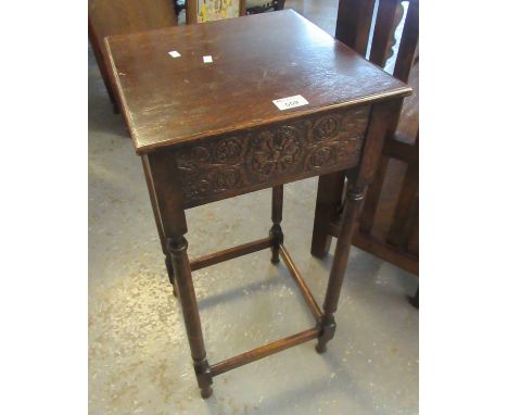 Early 20th Century oak lamp table of square form with carved foliate frieze on turned legs. (B.P. 21% + VAT) 