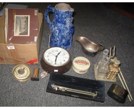 Box of miscellaneous items to include: a Smith's vintage wall clock, a cased drawing or cartography protractor, an unframed p