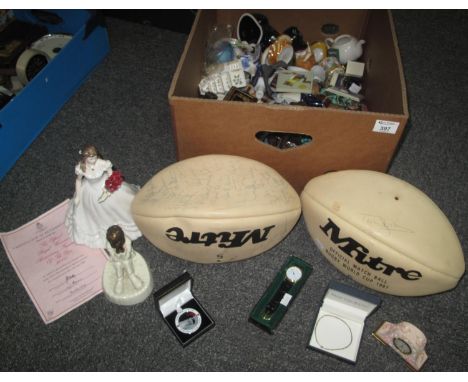 A box of assorted oddments including: two signed rugby balls, a Royal Minton figurine and a Royal Worcester figurine with Cer