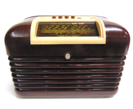 TWO RADIOS comprising a Bush Type DAC 10 brown bakelite radio, serial no. 62/62549, in working order; and a Philips Type 940A
