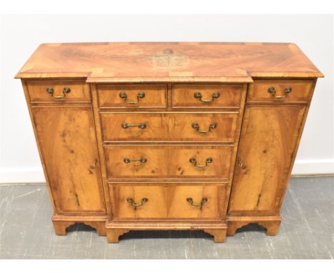 GEORGIAN BREAKFRONT SIDEBOARD, the central compartment having two short above three long graduated drawers, flanked by a shor