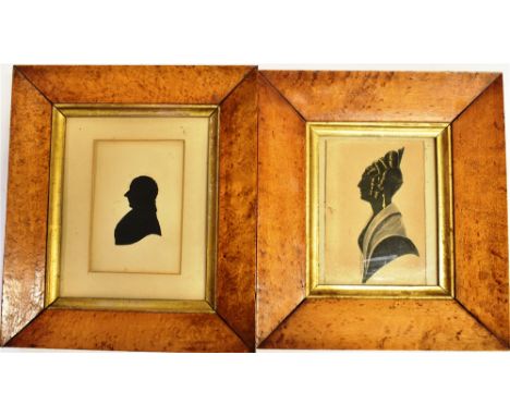 19TH CENTURY SCHOOL Silhouette portrait of a lady, heightened in gilt, and another of a gentleman, both in maple frames 19.5c