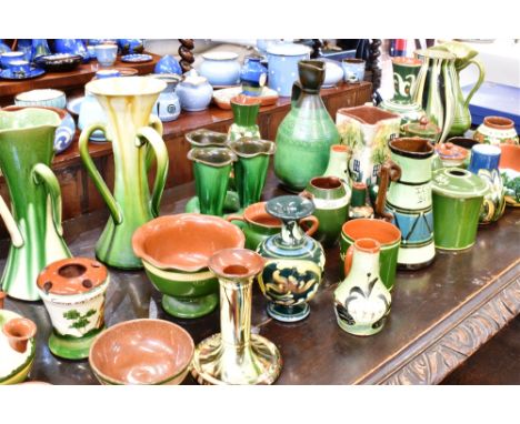 A COLLECTION OF ASSORTED DEVONWARE  mostly green ground, including Babbacombe, Aller Vale and Torquay pottery, the largest it