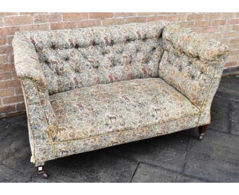 LATE 19TH/EARLY 20th CENTURY CHESTERFIELD STYLE FLORAL UPHOLSTERED DROP END SOFA, raised on square tapering legs with casters