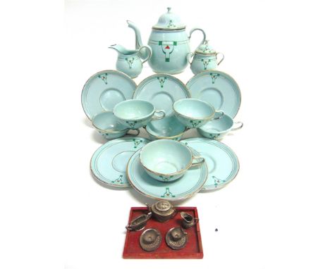 A DOLL'S ENAMEL TEA SERVICE  circa 1930s, comprising tea pot, milk jug, sucrier, six cups, and six saucers, the tea pot 11.5c