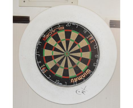 A Winmau Blade 4 dart board with foam surround.