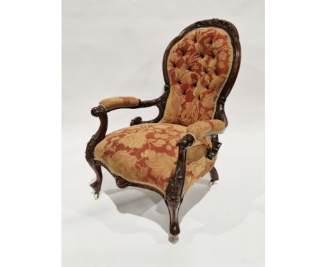 Victorian mahogany framed open armchair&nbsp;with button back orange and brown floral patterned upholstery, the frame with fo