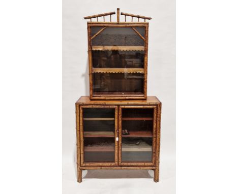19th century aesthetic-movement bamboo display cabinet, the upper section with an arched balustrade pediment over a single gl