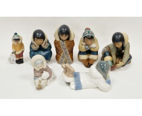 Collection of Lladro figures of Inuit children, four of large size in matt glazes, one similar smaller modelled standing besi