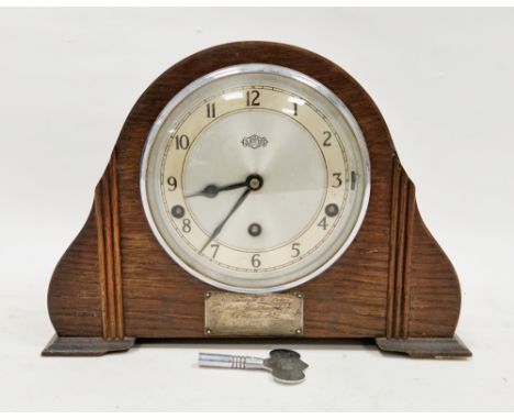 Garrard of London early 20th century oak domed top mantel clock, the face with three winding holes and Arabic numerals, with 