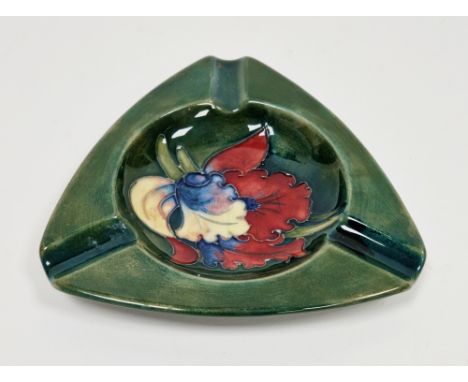 Moorcroft pottery green ground Hibiscus pattern ashtray, circa 1960's/70's, impressed Moorcroft marks, of shaped triangular f