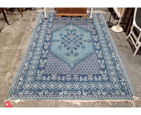 Large Tunisian blue ground rug&nbsp;with central floral medallion, geometric trelliswork spandrel, multiple geometric borders