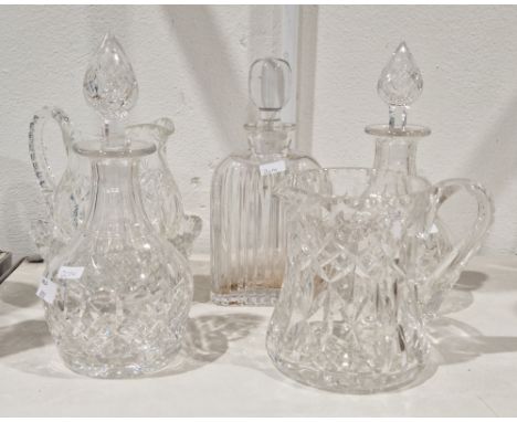 Two 20th century cut-glass decanters and stoppers, cut with diamonds, a compressed arched rectangular fluted spirit decanter 