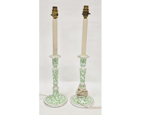 Pair of contemporary pottery candlestick table lamps, each decorated with green vermicule pattern, within gilt rims, electrif