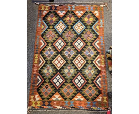 Maimana Kilim&nbsp;black ground rug with two rows of four lozenges and three rows of five hooked lozenges, single geometric b