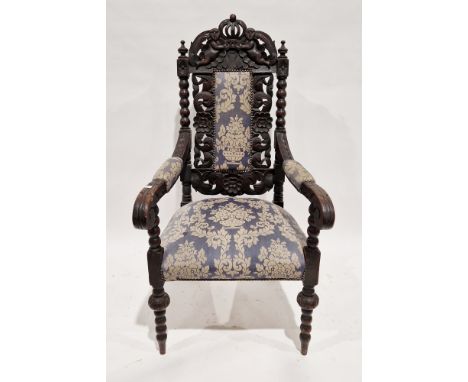 19th century oak hall elbow chair&nbsp;profusely carved including a crown and cherub domed top rail, bobbin supports and a fl