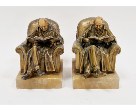 Two early 20th century gilt metal bookends&nbsp;on onyx bases, after J Ruhl, stamped J.B.H &amp; Co for J B Hirsch, each cast