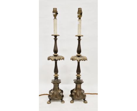 Pair of 20th century gilt-metal Baroque style candlestick table lamps, each of baluster form, with fruit and leaf-moulded dri