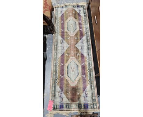 Modern green ground runner with two central octagonal medallions on striped field with stylised animals, stylised animal span