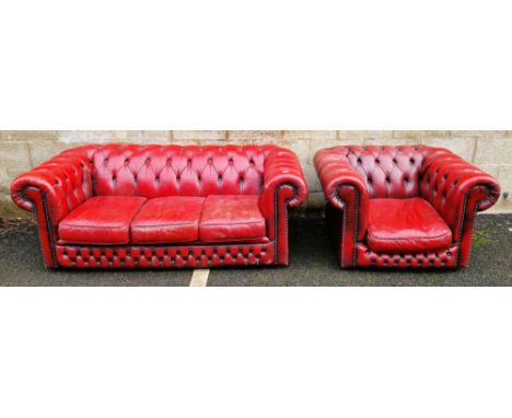 Office reception Chesterfield-style red buttoned leather-effect three-seater sofa&nbsp;with brass studding, 70cm high x 185cm