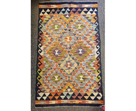 Chobi Kilim&nbsp;blue ground rug with geometric pattern design flanked by single geometric border 131cm x 79cm