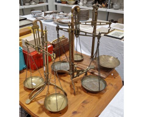 Set of late 19th / early 20th century brass balance scales by W &amp; T Avery Ltd on three splayed feet, 56cm high together w