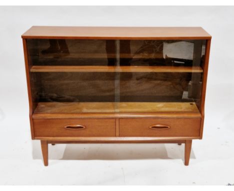 Mid-century retro teak cabinet&nbsp;by Jentique, having two glass sliding doors opening to an adjustable shelf over two drawe
