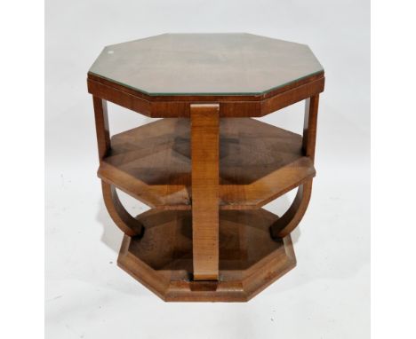 Art Deco walnut square veneer octagonal centre table, the top with glass cover over a shelf and platform base, 70cm high x 69
