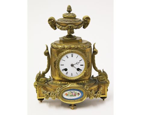 A late 19th Century gilt brass mantel clock with enamel dial and panel. H30cm