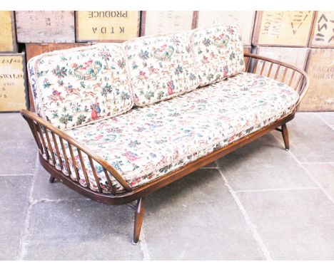 An Ercol dark elm and beech day bed. L205cm