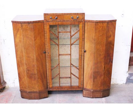 An Art Deco walnut cabinet bookcase. W124cm D35cm H116cm