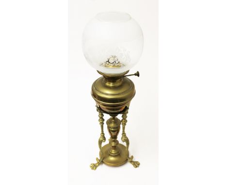 A 19th Century brass oil lamp and shade. H63cm
