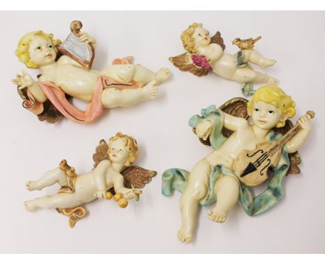 A group of four vintage italian plastics cherubs