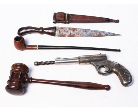 A mixed lot comprising a Middle Eastern dagger, a silver mounted rosewood gavel, a vintage pipe and a pistol