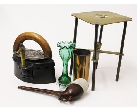 A mixed lot comprising a 19th Century clay pipe with a footballers boot and ball, an Otto iron, a brass trivet etc.