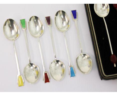 A set of six Art Deco hallmarked silver and enamel tea spoons and another set