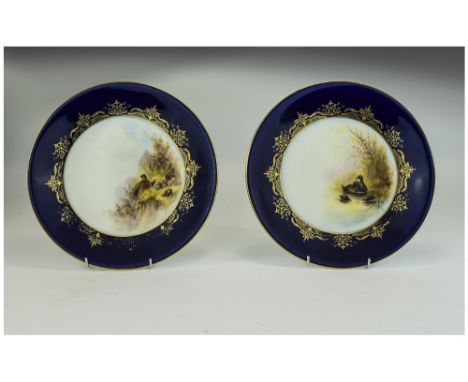 Royal Worcester Pair of Dessert Plates 'Water Birds', each hand painted over print, signed C.Johnson, and titled to the under