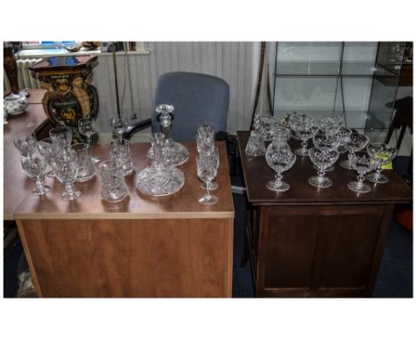 Collection of Cut Glass Items including decanters, white wine glasses, red wine glasses, tankards, dessert dishes, champagne 