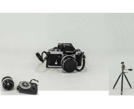 A Japanese Nikon Camera together with a selection of lenses, old tripod and accessories etc A/F