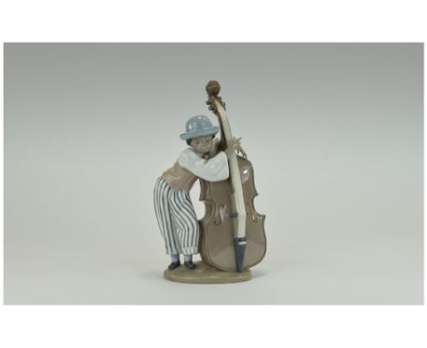 Lladro Figure"Jazz Bass" Model number 5834, issued 1991. 10" inches high. Mint condition, boxed 