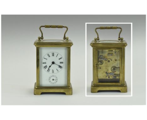 English 19th Century Brass Carriage Alarm Clock. With alarm strikes on a bell. Features a white porcelain dial. Dial for alar