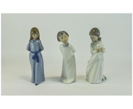 Nao by Lladro Figures ( 3 ) In Total. A Boy and Girl In Nightdress's. 9.25 - 9.75 Inches Tall, Young Girl In Blue Dress, 10 I