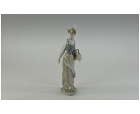 Lladro Figure - Dutch Girl with Basket of Lilies. Model Num 1399. Issued 1982 to 1988. Height 10.5 Inches, Excellent Conditio