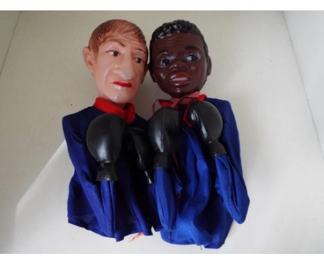 Two vintage boxing puppets in the style of Mohammed Ali and Howard Cosell (sportscaster) manufactured by SMC of Hong Kong, cl