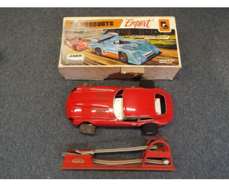 A good lot to include a kit made model of a Jaguar E-type in associated box and a vintage Codeg car catapault