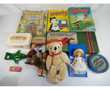 A good mixed lot to include a vintage Totopoly game, a Nintendo Donkey King game and watch game, four children's annuals comp